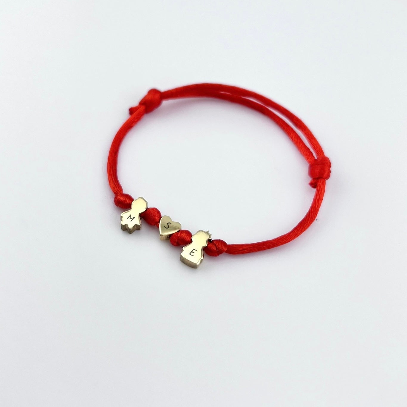 Cord bracelet with kid charms