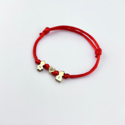 Cord bracelet with kid charms