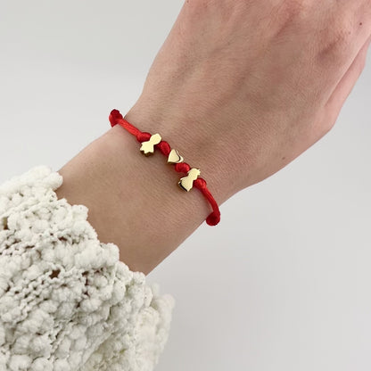 Cord bracelet with kid charms