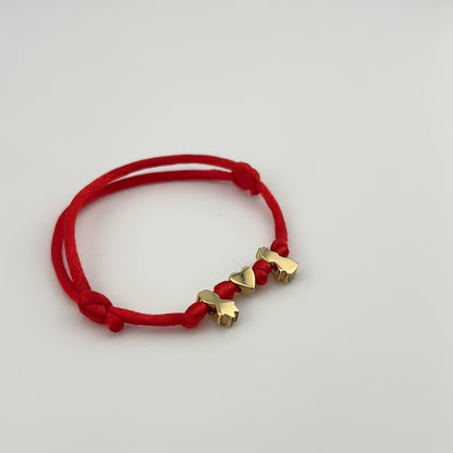 Cord bracelet with kid charms